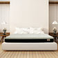 Mattress displayed in a bedroom setting with wooden flooring and minimal decor.